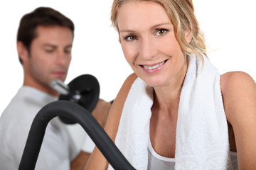 Man and woman working out in gym