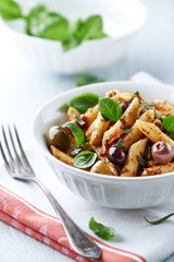Penne pasta with dried tomato pesto and marinated olives