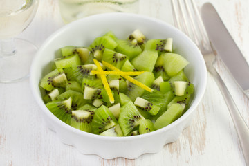 dessert of kiwi in the white dish
