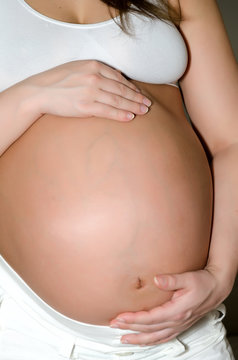 Bellies of pregnant women.