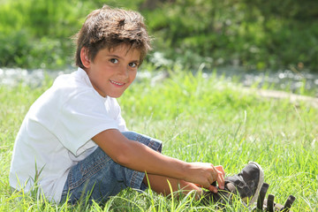 Child sitting in a field