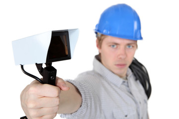 portrait of young electrician against white background