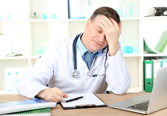 Medical doctor working at desk