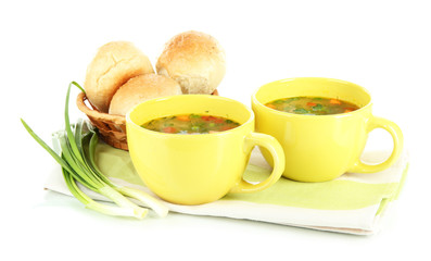 Fragrant soup in cups isolated on white