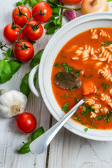 Tomato soup and fresh ingredients