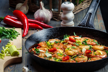 Closeup of freshly fried shrimps with herbs