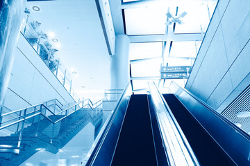 Escalator in modern interior toned