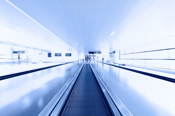 Escalator in modern interior toned