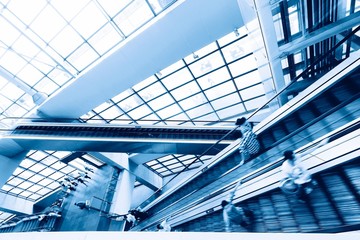 Escalator in modern interior toned