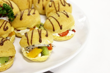 Clair decorated with mixed  fruit chocolate