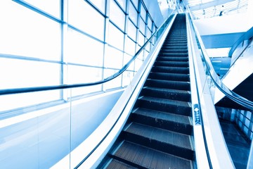 Escalator in modern interior toned