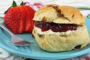 English scone with strawberry jam and clotted cream