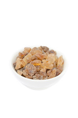 sugar candy in a white bowl isolated
