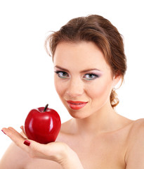 Beautiful young woman with bright make-up, holding red apple,