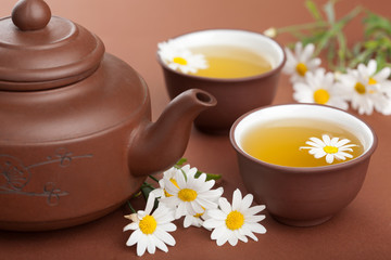 green tea with chamomile flowers
