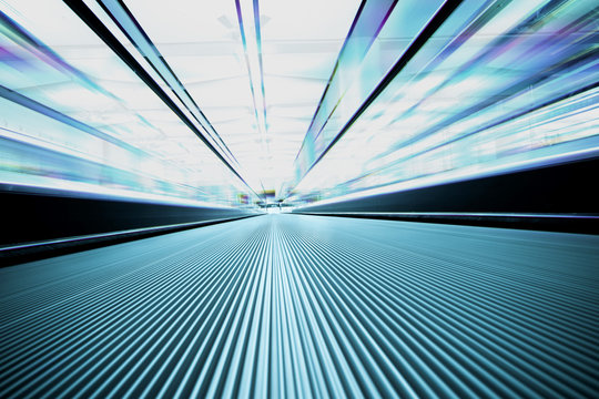 Escalator in modern interior toned