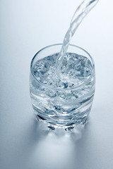 Water flowing into glass