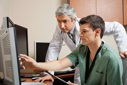 Doctor And Technician Working Together
