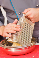 Chef are grating cheese