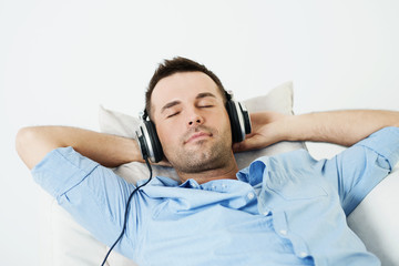 Dreaming man listening to music