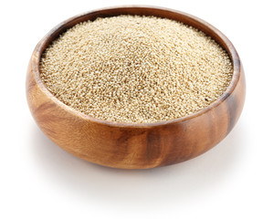 uncooked quinoa in the wooden bowl
