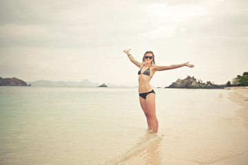 Fototapeta na wymiar Relaxing woman on the beach