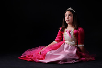 Litle princes with nice pose isolated black background