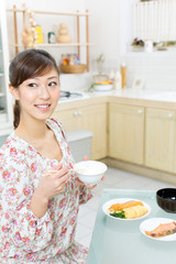 Beautiful asian woman eating lunch