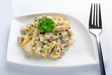 Eggs and mushrooms salad with leek and red onion on the plate