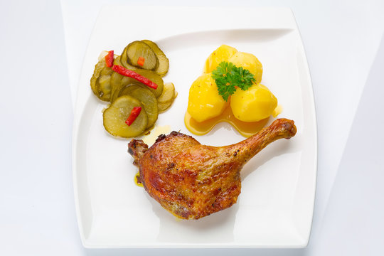 Roast Duck Leg With Potatoes And Picke Salad