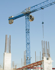Construction crane - building a house - obrazy, fototapety, plakaty