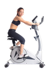 Fototapeta premium Brunette woman on bike exerciser