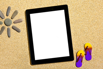 Tablet lying on the sand