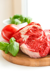 Organic Red Raw Steak on cutting board