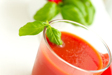 Tomato juice on white wooden table background