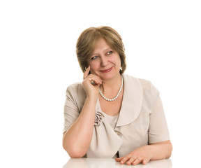 An elderly woman smiles on a white background, isolated