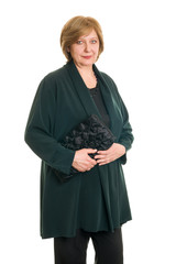 An elderly woman smiles on a white background, isolated