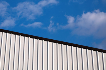 Fototapeta premium Corrugated Metal Roof against Blue Sky