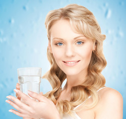 woman holding glass of water