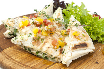 pita bread with vegetables on a plate in a restaurant
