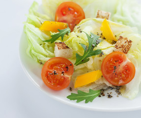 Fresh salad - cherry tomatoes, rucola, paprika and croutons