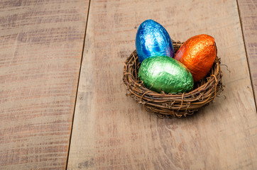 Small bird's nest with foil eggs