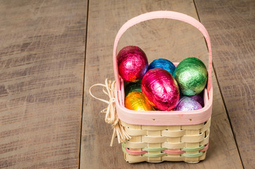 Wicker Easter basket with foil eggs