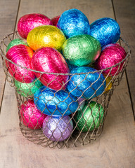 Wire egg basket with colorful eggs