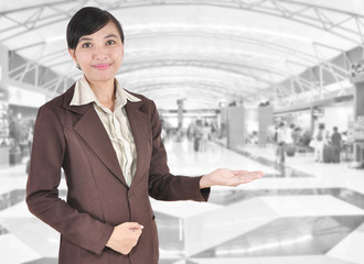 Young businesswoman smiling with her arms open in the office