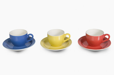 Fototapeta premium Colorful tea cups with saucers in a row