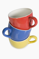 Close-up of a stack of colorful tea cups