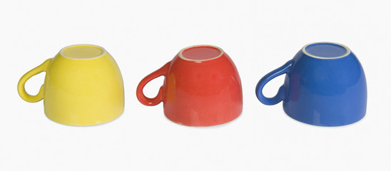 Close-up of colorful tea cups in a row