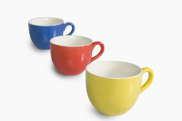 Close-up of colorful tea cups in a row