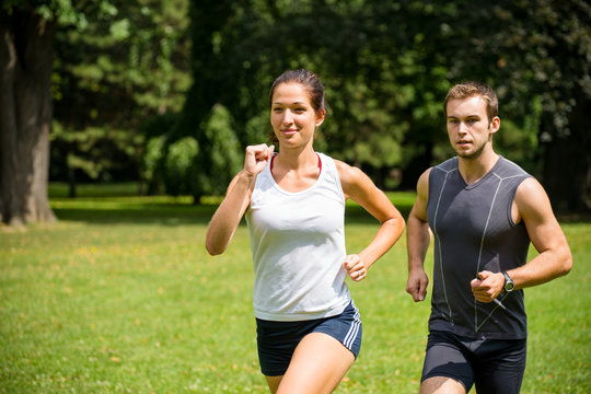 Jogging together - young couple competing